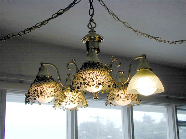 It is difficult to see in the photo but the glass beads glow a subtle color.