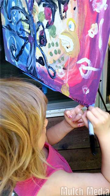 This is about the point that Madeline didn't want to paint anymore. The girls took a break to explore spiders in the backyard. I had her come over and make some final touches before I cleaned up.

Artists should always sign their work!