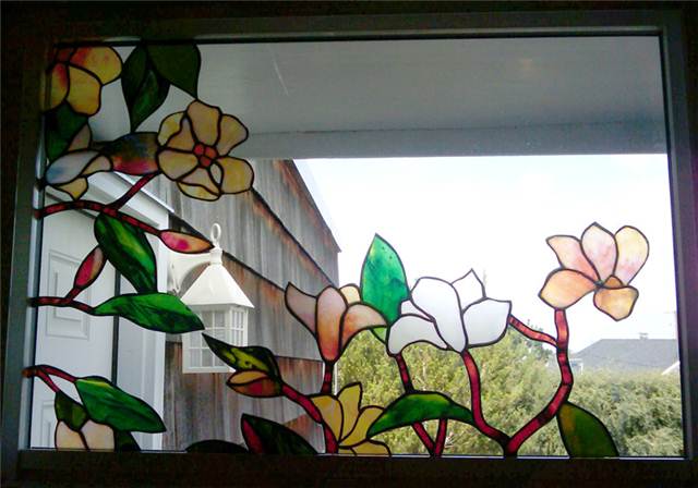Upper window with cut out flowers.