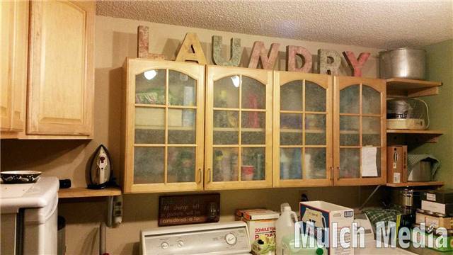 Laundry room nearly complete. I found most of the "LAUNDRY" letters on discount at a craft store. I was missing an "N" and "R" but some creative surgery fixed that.